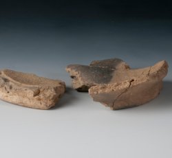 Colonoware hollow vessel base, possible milkpan.