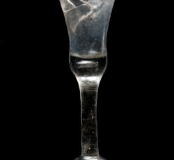 Wine glass with waisted bell bowl and conical, folded foot.
