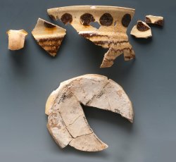 Staffordshire slipware trailed, combed, and dotted drinking pot.