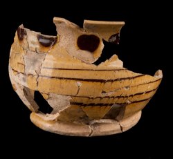 Staffordshire slipware trailed, combed, and dotted drinking pot.