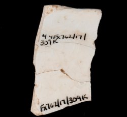 Whiteware saucer with maker's mark.