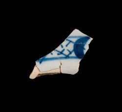 Tin-glazed earthenware flateware with trellis border.