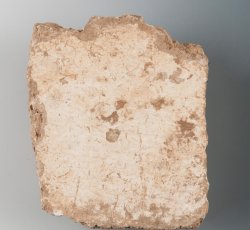 Plaster fragment with flat surface adjacent to finished surface.Plaster fragment with flat surface adjacent to finished surface.