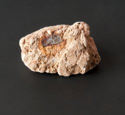 Plaster fragment with iron nail. 