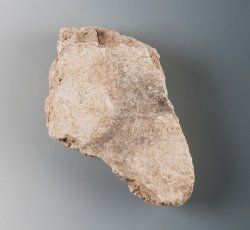 Plaster fragment with lathe marks.