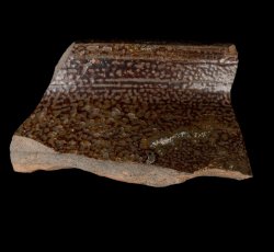 Brown stoneware jar.