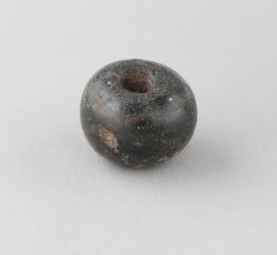 Large, wound, simple black bead.