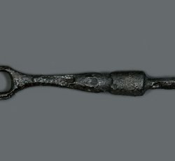 Iron, two-tined table fork.
