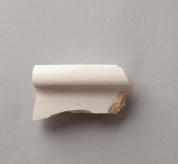 White salt-glazed stoneware chamberpot.