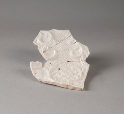 White salt-glazed stoneware fruit dish.