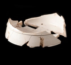 White salt-glazed stoneware mug base.