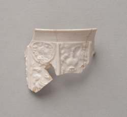 White salt-glazed stoneware Aesop's fable-molded cup (coffee or chocolate).