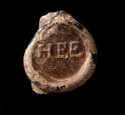 "HEE" wine bottle seal.