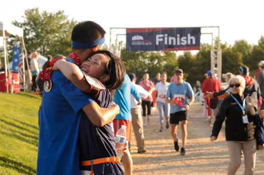 Woman embraces man at Finish Line