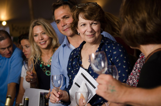 Guests enjoying a wine tasting.