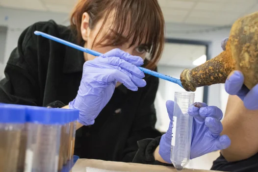 Archaeologist with cherry bottle