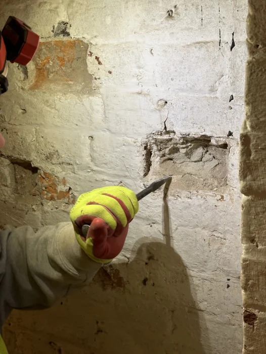 Modern concrete is cut away in the cellar.