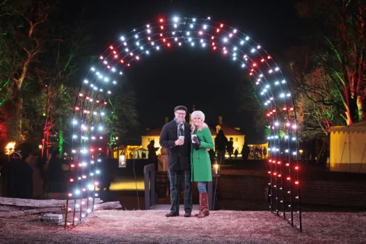 Guests posing under Holiday Lights 