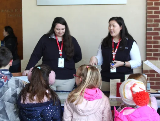 Mount Vernon educators talking to young visitors