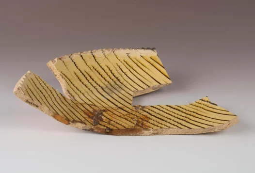 Staffordshire slipware trailed and combed dish with pie crust rim.