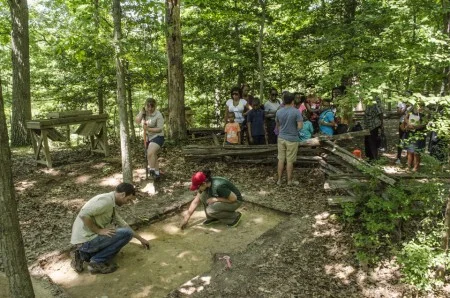 A group working at the Slave Memorial & African American Burial Ground