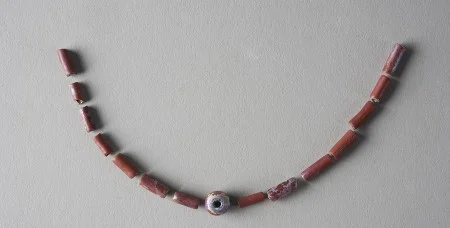 These beads were recovered from the House for Families cellar. Most often identified as an object of bodily adornment, beads could also have adorned a shegureh, rattle, or tambourine. (MVLA)
