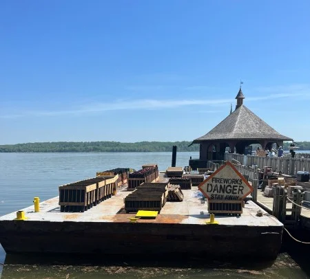Mount Vernon's firework platform is prepared to be towed 500 feet into the Potomac River. Photo by Sam Snyder.