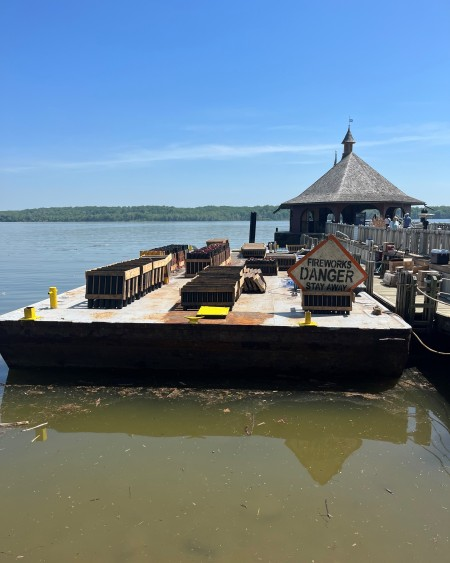 Mount Vernon's firework platform is prepared to be towed 500 feet into the Potomac River. Photo by Sam Snyder.