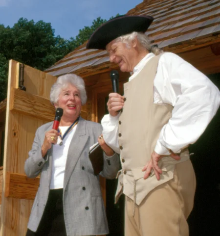 Mrs. Morrissette introduces a George Washington reenactor to children gathered for the treading barn dedication. MVLA. 
