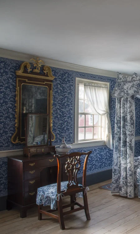 To prepare for the day, eighteenth-century century guests would have sat at a dressing table such as this, using the small mirror, known as a dressing glass, to guide their preparations. The Chinese porcelain water bottle and wash basin were used to wash face and hands. (Gavin Ashworth, MVLA)