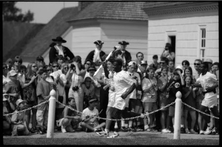 Darrell Green running around the Mansion Circle with the Olympic Torch, 1996, MVLA.