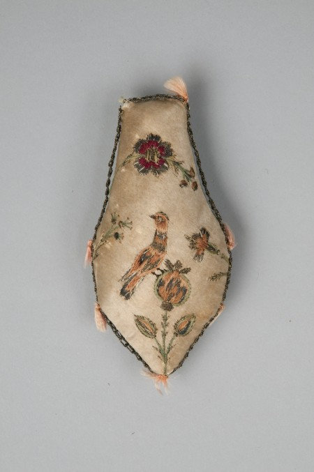Martha Washington is believed to have embroidered this elegant pincushion during the winter encampment at Valley Forge as a present for the daughter of her host.  [W-2738/B]