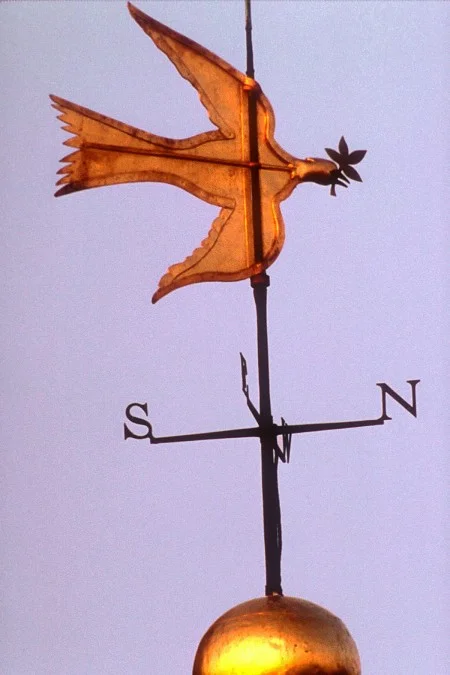 The original dove of peace weathervane was removed for preservation purposes, today a replica sits atop the cupola.