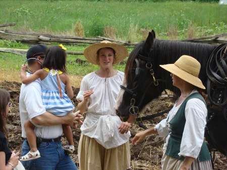 Livestock staff showing guests a draft horse. (MVLA)