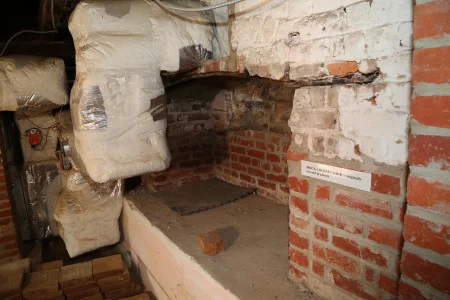 Outdated HVAC system and an original chimney covered in plaster, MVLA. 