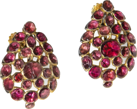 Before the importation of British luxury trade items was halted by the colonies' non-importation agreement, George Washington purchased these fine garnet earrings from London for his wife Martha in December 1760. The Mount Vernon Ladies' Association.