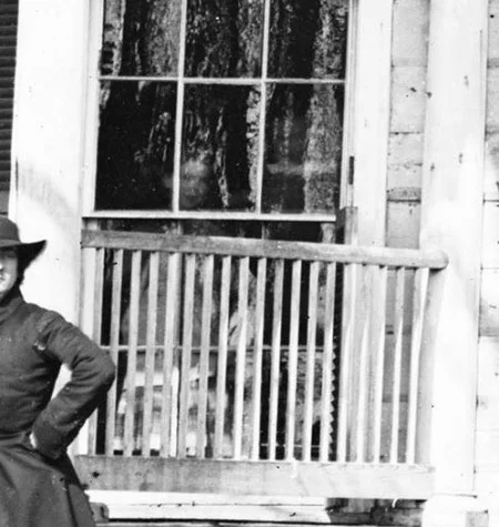 An unknown individual is visible through a window of the Mansion. (MVLA)