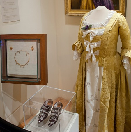 Visitors to Mount Vernon can see reproductions of Martha Washington's gold silk damask wedding dress and sequin-covered shoes in the museum (MVLA)