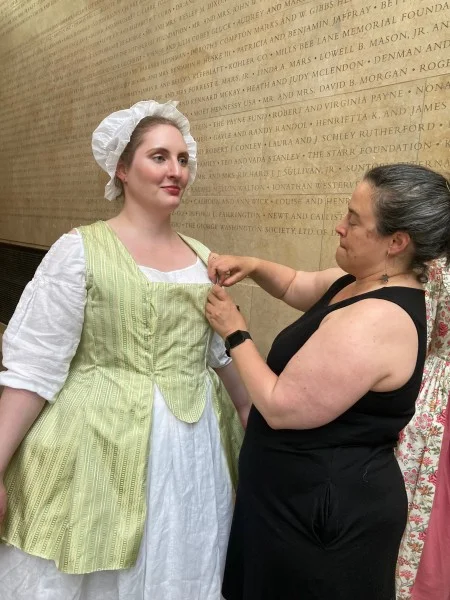 Rachel Samson, a character interpreter portraying a woman named Mary Wheatley, is fitted in a short sack, known in French as a pet-en-l'air. (MVLA)