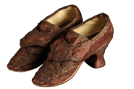 Made of purple silk, these shoes are believed to have been worn by Martha Dandridge Custis during her wedding to George Washington. They not only reflect Martha’s status as a wealthy widow but also her youthful exuberance. (MVLA)