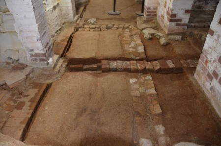 Detail view of one 18th-century drain cutting through an even earlier 18th-century drain. The drains were exposed during archaeological excavations in the Cellar Passage. The earlier drain curves to form a corner roughly outlining the northeast corner of the early house. The excavations exposed several drainage systems and early foundation walls. (MVLA)