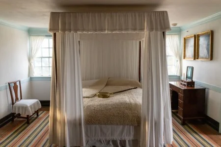 The Washingtons' bed with a bed rug and bed warmer. MVLA