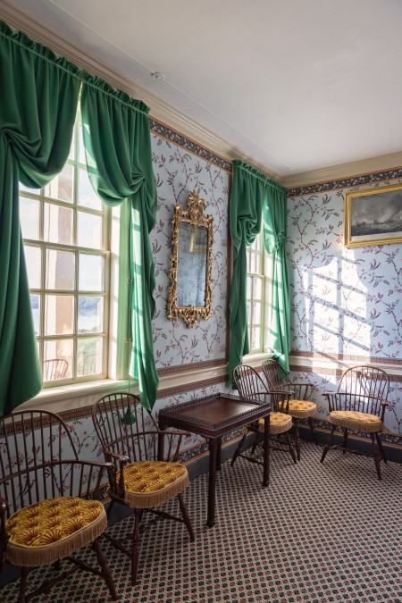 Sack-back Windsor armchairs and china table in the Little Parlor.