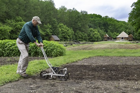 Dean Norton, director of horticulture at Mount Vernon, plants industrial hemp at the four-acre Farm site. (MVLA)
