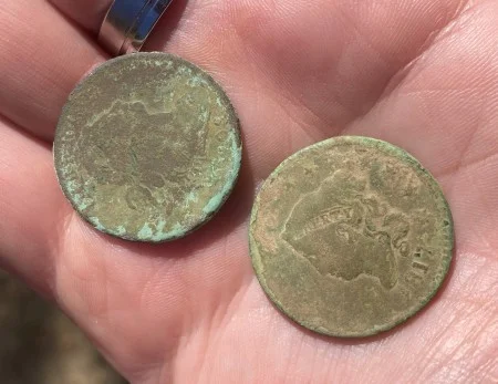 Two "large cent" copper coins represent multiple generations of Washington households. (MVLA)
