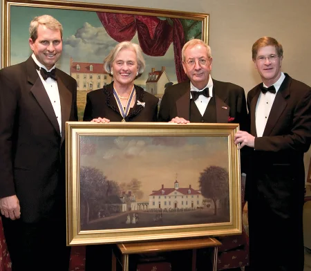 Steve Anderson, president of the Donald W. Reynolds Foundation, Mrs. Walton, Reynolds Foundation Chairman Fred W. Smith, and Mount Vernon Executive Director James C. Rees hold a copy of a 1792 painting of the Mansion by Edward Savage. MVLA. 