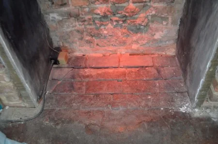 Faint outline of the angled, Rumford firebox