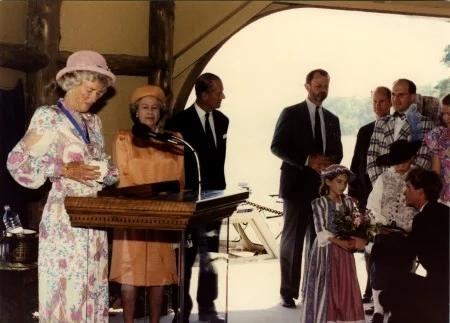 Queen Elizabeth II is presented with a bouquet of flowers from George Washington's garden and a silver George Washington medallion. (Mount Vernon Ladies' Association)