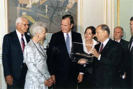 Mrs. Seamans meets with President George H. W. Bush and French President Francois Mitterrand in France, where she hand-delivered the key to the Bastille that had originally been given to George Washington by Marquis de Lafayette in 1790. In 1989, this ceremony marked the 200th anniversary of the French Revolution. MVLA. 