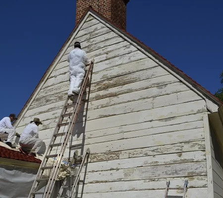 Stripping paint on the Servants' Hall, MVLA.